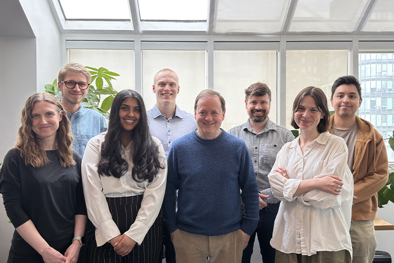 Portrait of the Juxta team in a brightly lit office