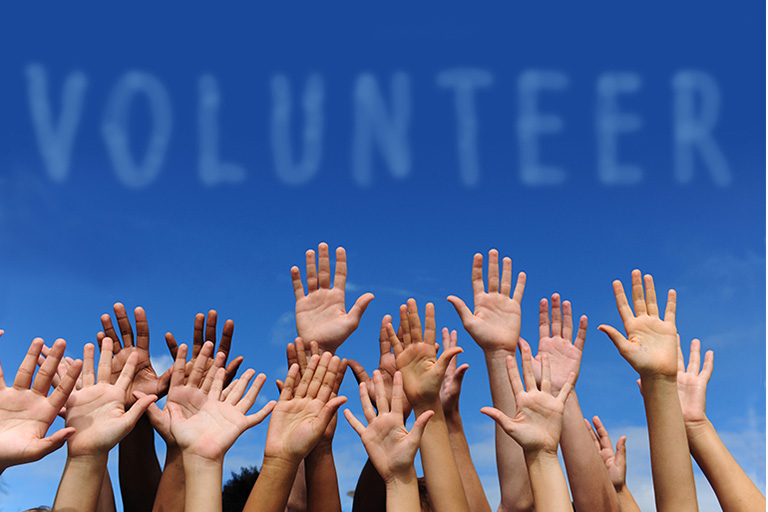 Volunteer image with multi cultural people raising hands
