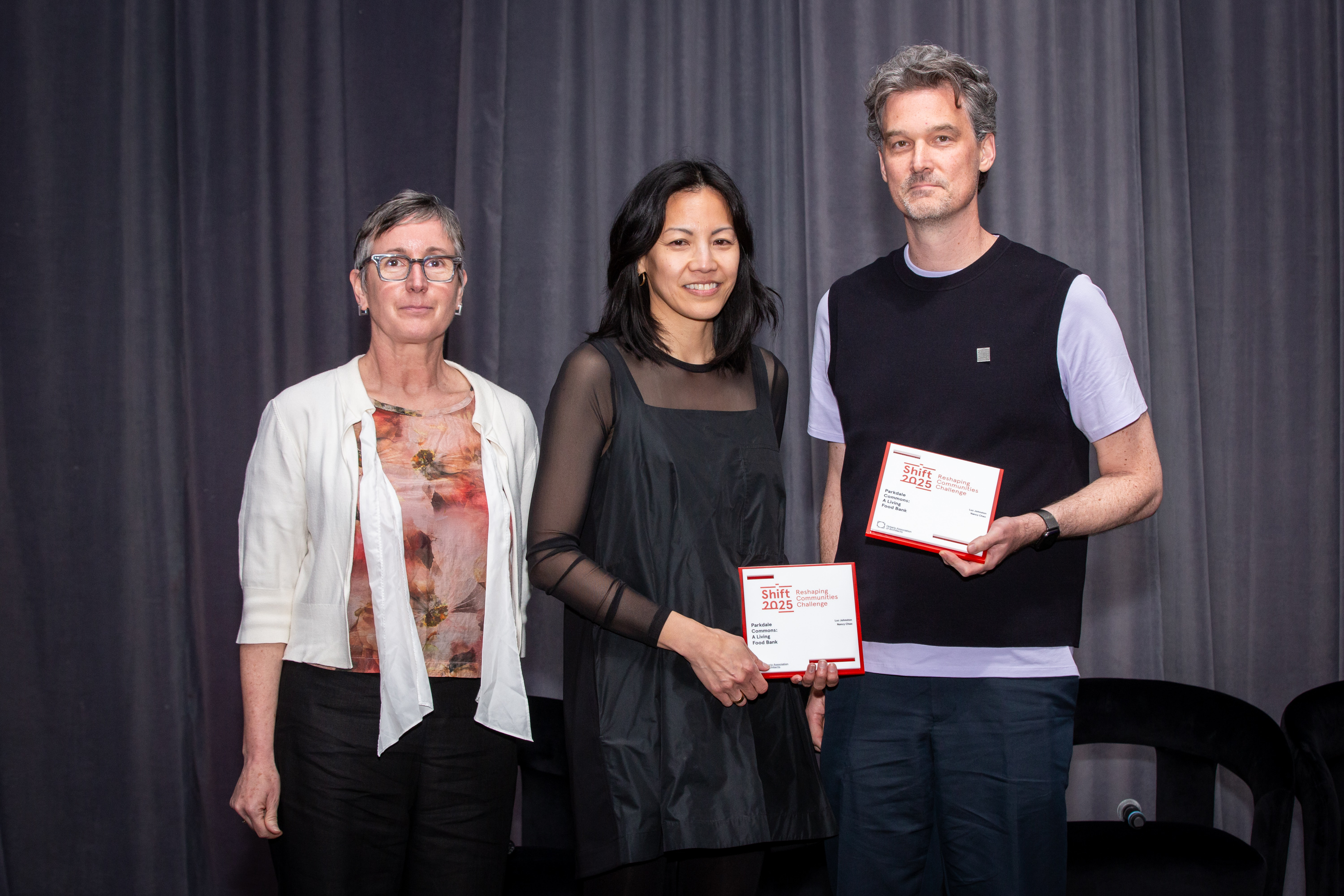 Nancy Chao and Luc Johnston accepting their award from OAA Senior Vice President and Treasurer Lara McKendrick 
