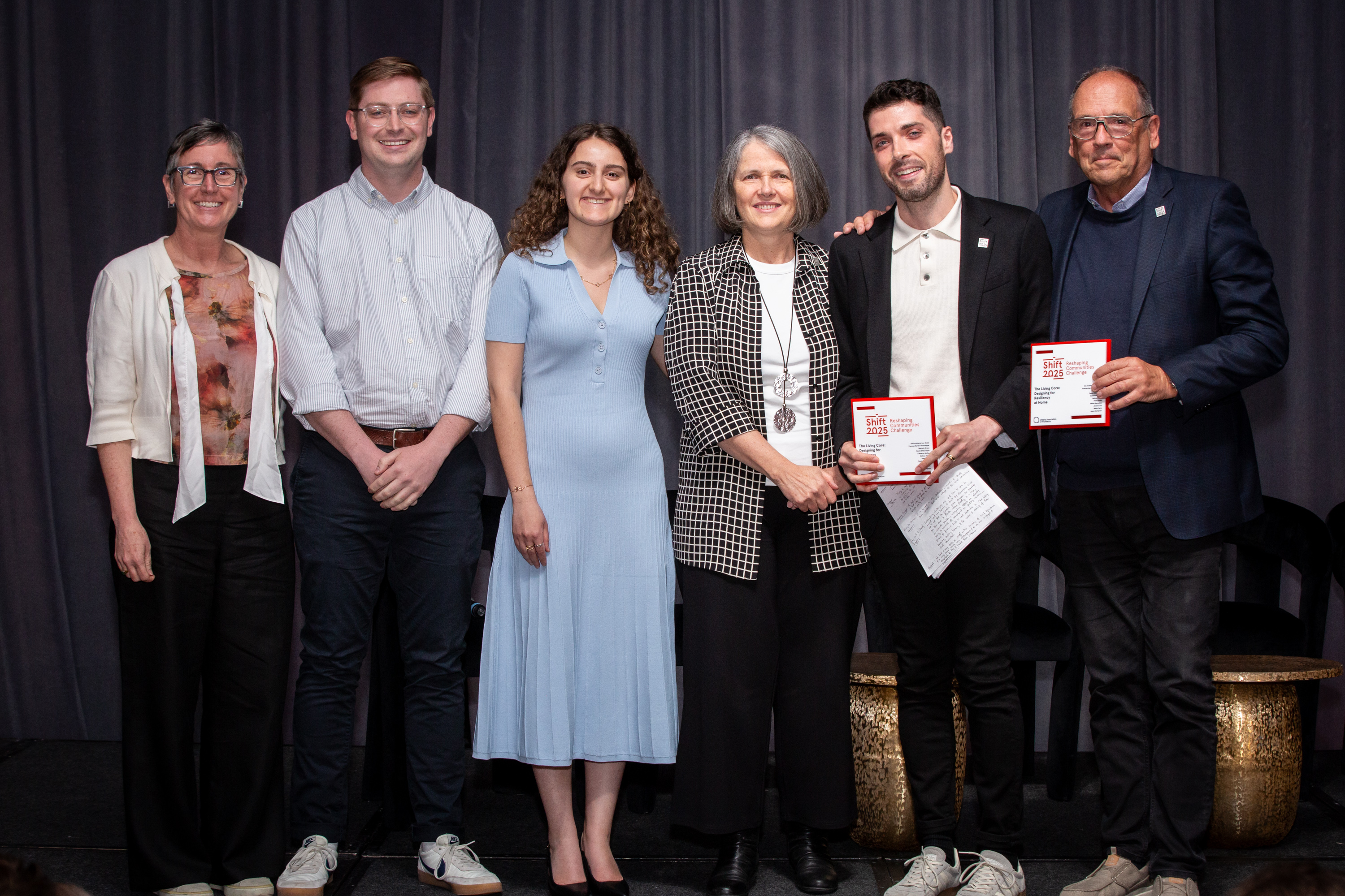 Senior VP Lara McKendrick poses with award with from left to right: Cameron McKay, Melissa Favas, David DiGiuseppe, Frances DiGiuseppe and Marcelo Graca.