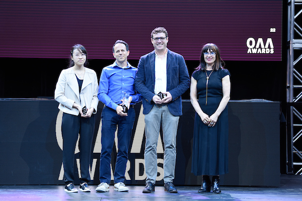 image of a group of individuals accepting an award onstage