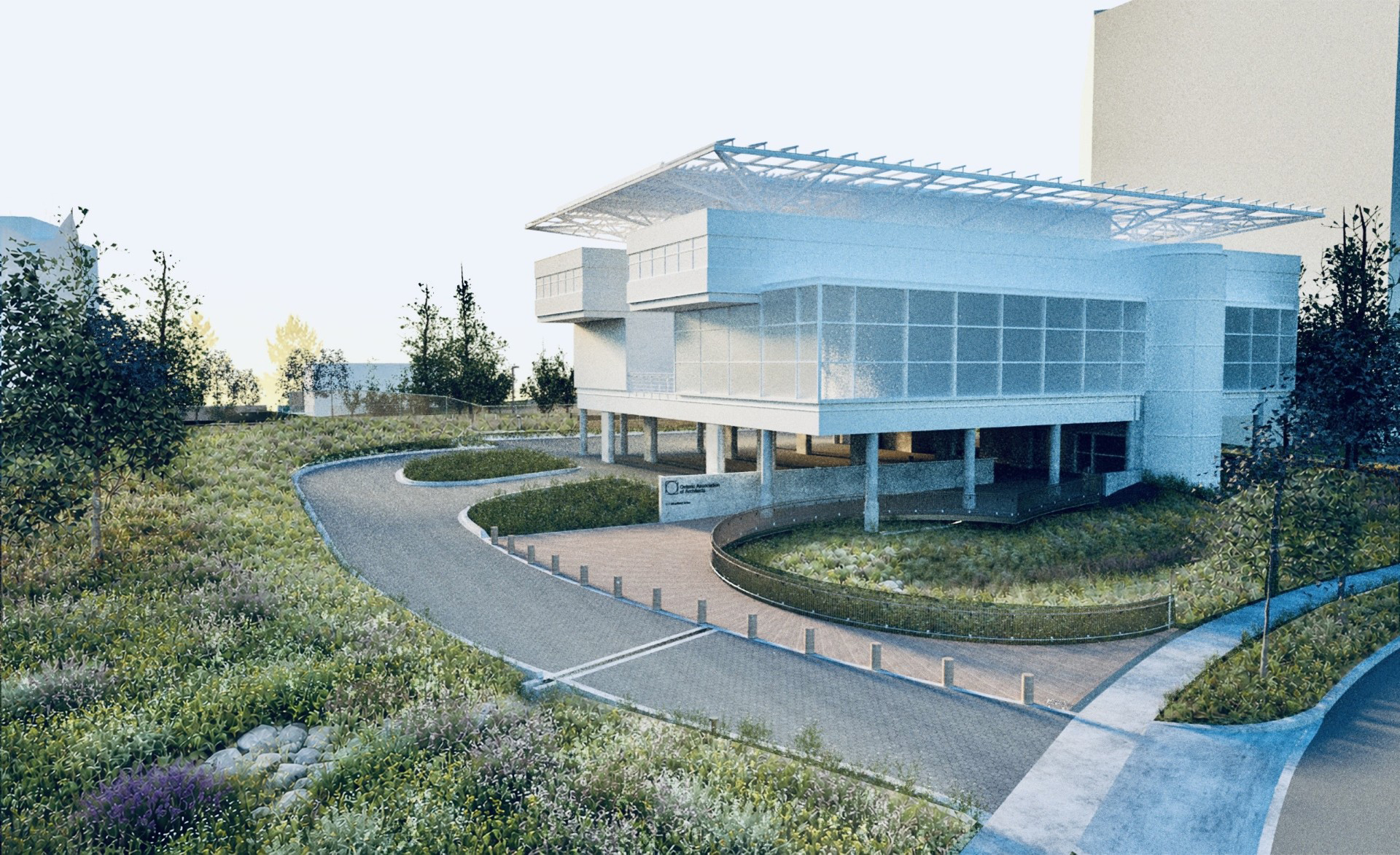 Modern building elevated on columns beside a curving roadway, surrounded by native planting and restored naturalized landscape.