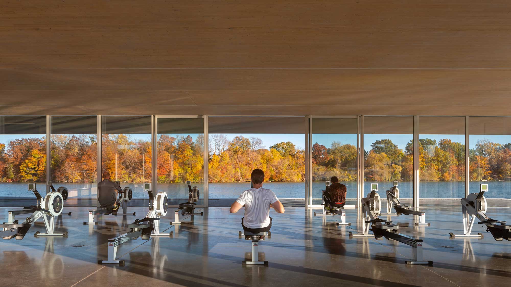 Erg room with open sliding doors and views facing east toward the Martindale Pond and Rowing Course