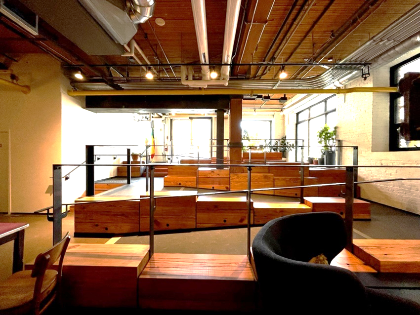 A wood toned industrial interior with exposed pipes