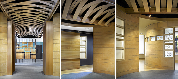 Interior views of a modern space featuring curved wooden walls and ceilings with intricate lattice-like wooden beams. The left image shows a hallway with a vaulted ceiling and patterned wood paneling leading to a decorative wood screen. The center and right images highlight curved walls with natural wood finishes and frosted glass panels adorned with abstract designs.