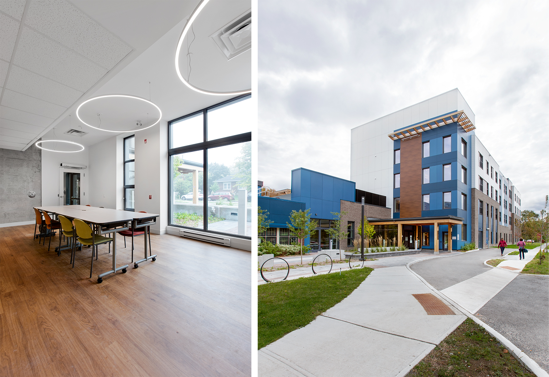 On the left, a bright interior amenity space with a large window, a long table, colorful chairs, and circular pendant lights hanging from the ceiling. On the right, an exterior view of a modern mid-rise building with blue, white, and gray facades, a wooden canopy over the entrance, and a landscaped sidewalk leading to the building. Two people are walking along the pathway.