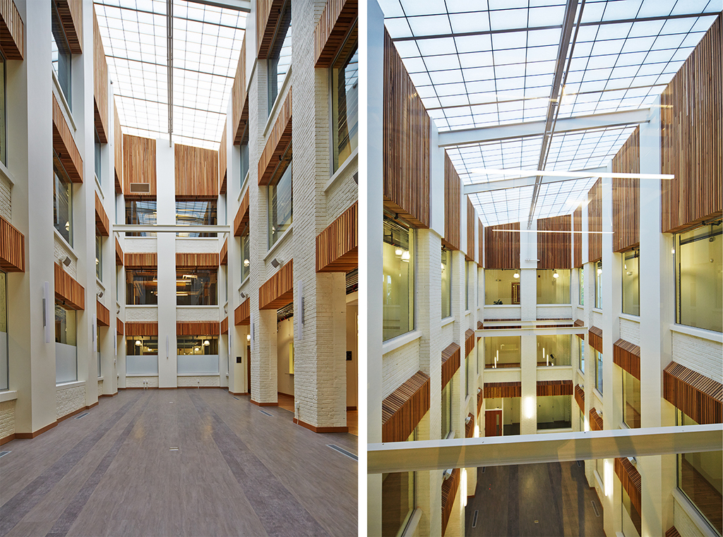 A composite of two interior views of a multi-story atrium with a translucent ceiling, allowing natural light to fill the space. The walls are white with wooden accents around the windows and along the upper sections of the floors. The floors are finished with light wood, and the overall design is modern and open, with clean lines and a bright atmosphere.