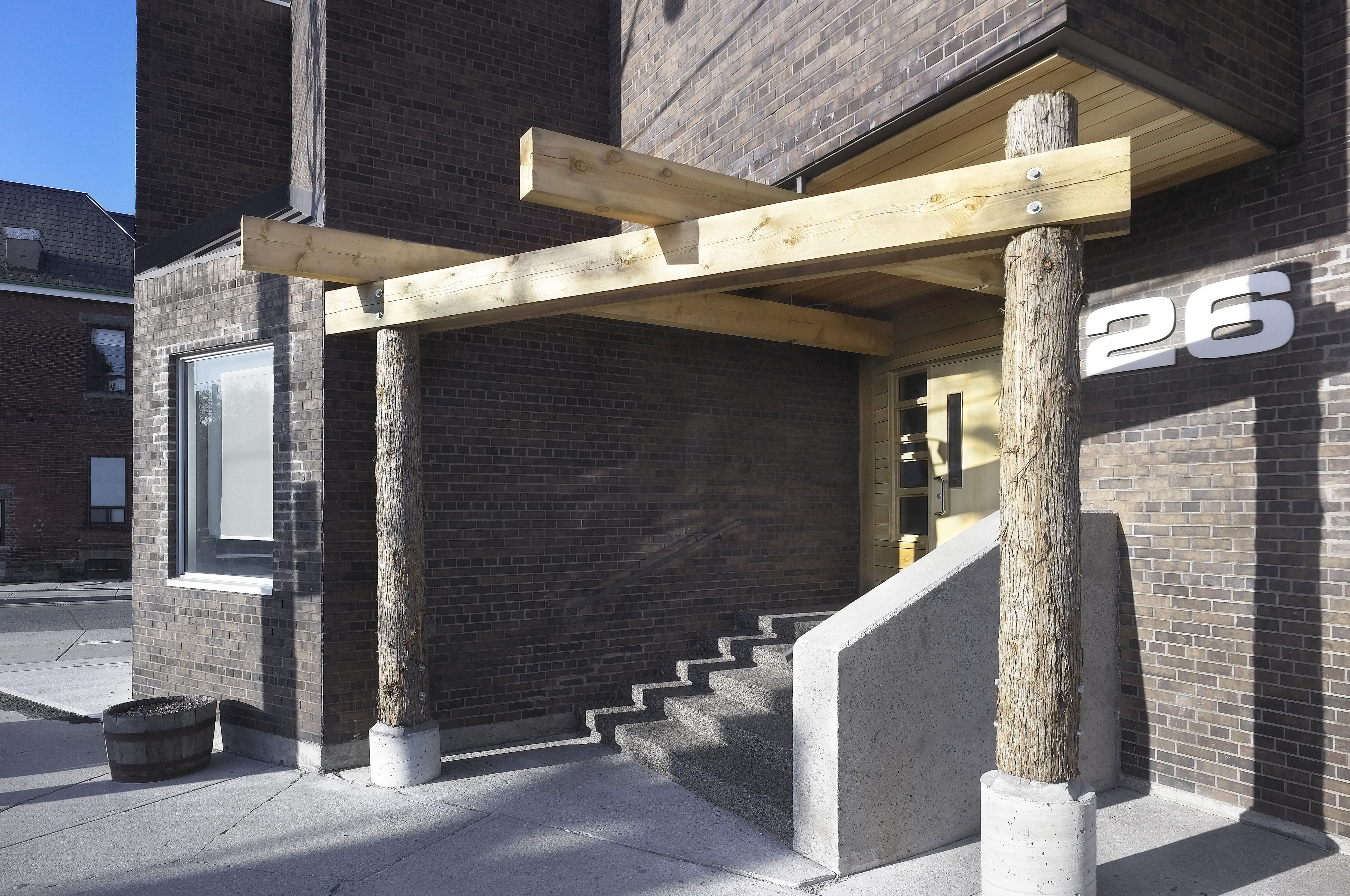    	 Front entrance with logs sourced by the executive director of Sagatay.